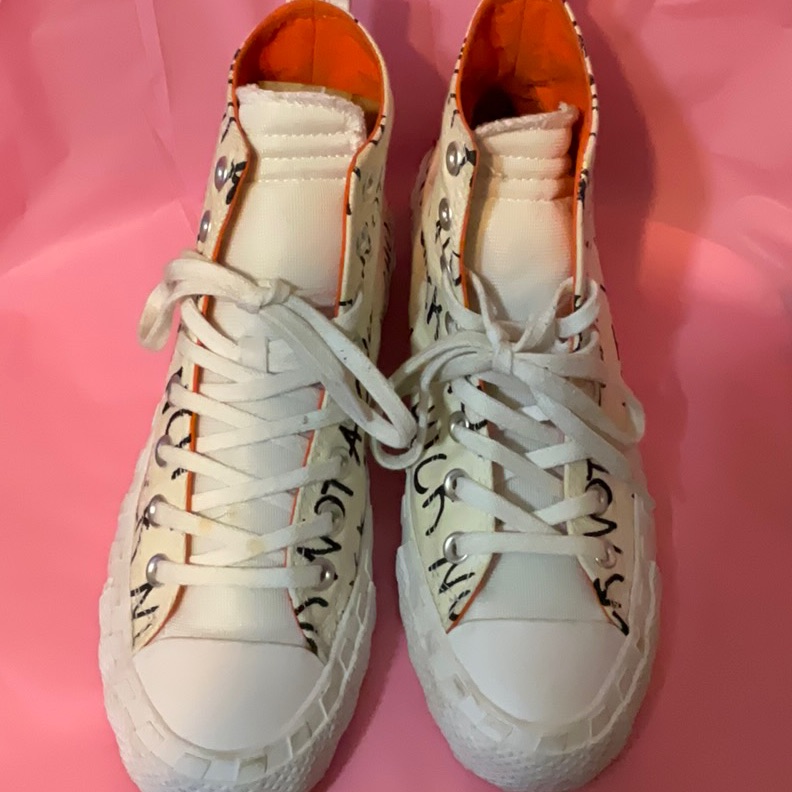White High-Top Sneakers With Black Lettering